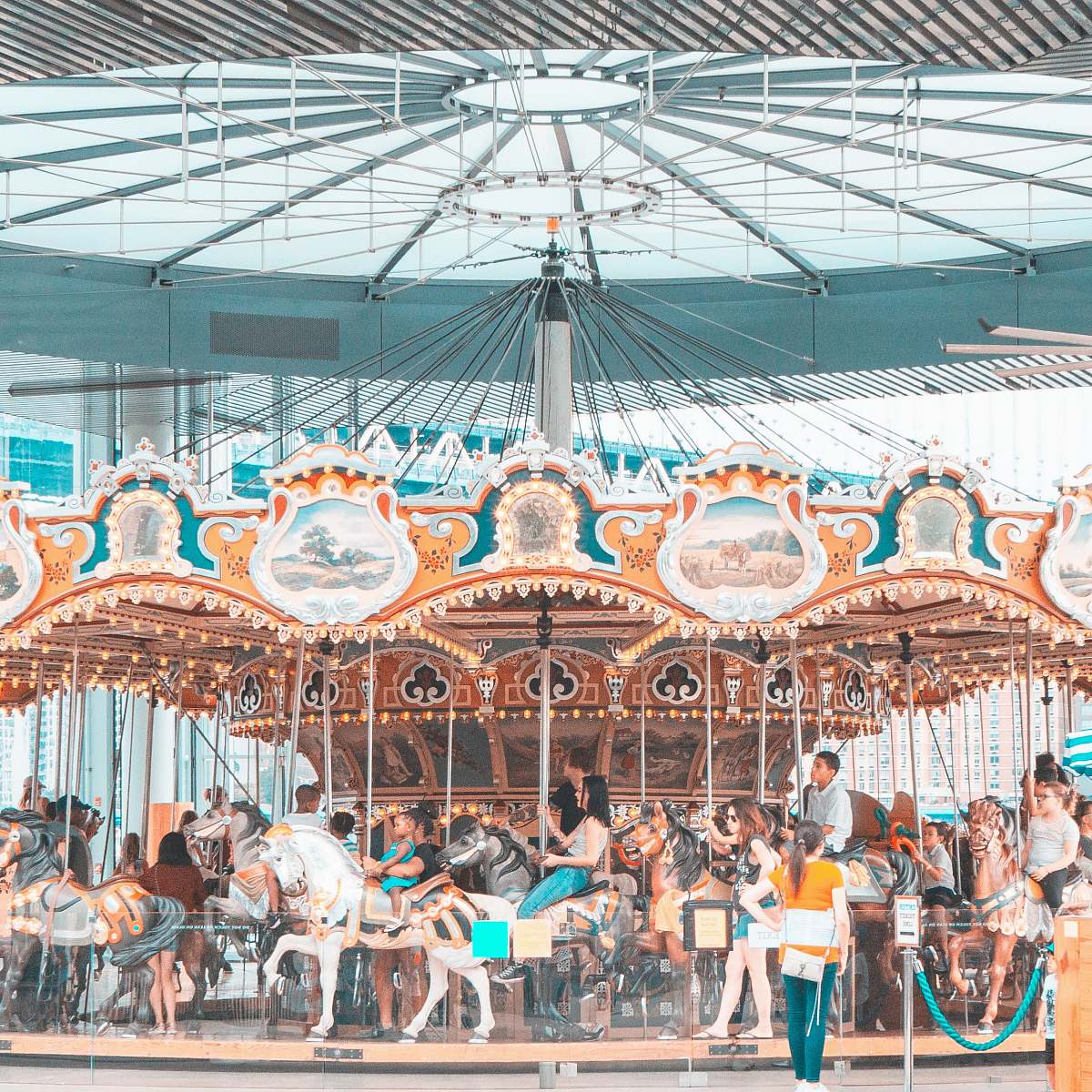 leisure activities people riding merry go round during daytime carousel